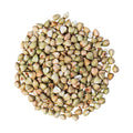 a pile of buckwheat groats on a white background