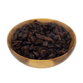 a small wooden bowl with dried cranberries on a white background