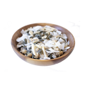 Wooden bowl filled with a mix of seeds and nuts on a white background