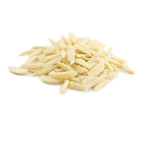 Small pile of blanched slivered almonds on a white background
