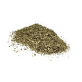 Pile of dried basil on a white background