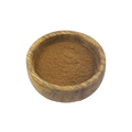 Wooden bowl filled with Cinnamon powder on a white background