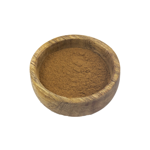 Wooden bowl filled with Cinnamon powder on a white background
