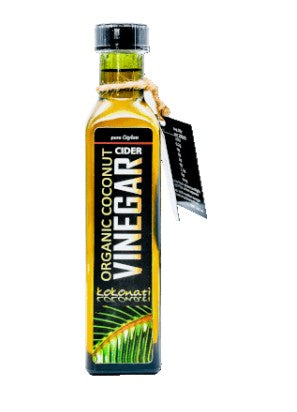 Bottle of organic coconut vinegar on a white background