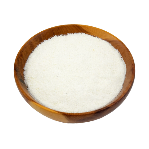 Wooden bowl filled with white sugar on a white background