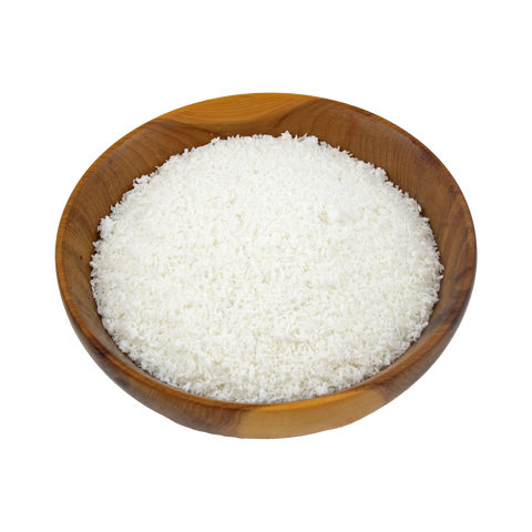 a wooden bowl with desiccated coconut on a white background