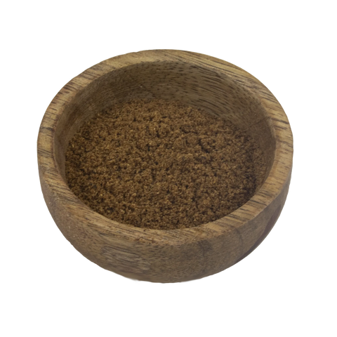 Wooden bowl filled with Garam Masala on a white background