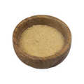 a small wooden bowl with garlic powder on a white background