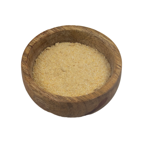 a small wooden bowl with garlic powder on a white background