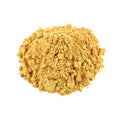 Pile of ginger powder on a white background