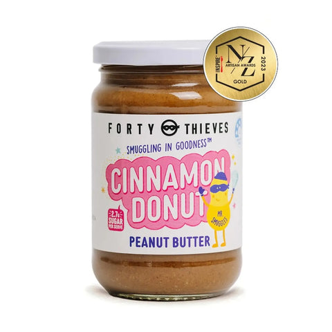 Jar of Forty Thieves Cinnamon Donut Peanut Butter with a gold medal label on a white background