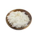 Wooden bowl filled with white shredded coconut on a white background