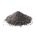 Poppy seeds in a pile on a white background