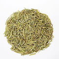 a small pile of dried rosemary leaves on a white background