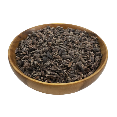 a small wooden bowl with cacao nibs on a white background