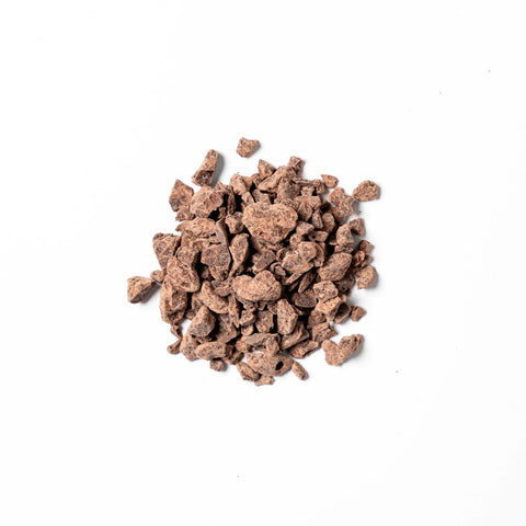 a pile of Solomon's Gold Chocolate Pieces on a white background