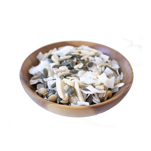 Wooden bowl filled with a mix of seeds and nuts on a white background